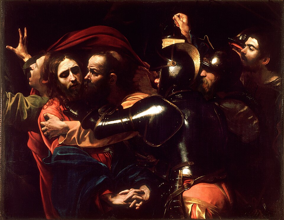 Judas beija Jesus no momento da traição, enquanto homens armados o cercam, em pintura de Caravaggio.